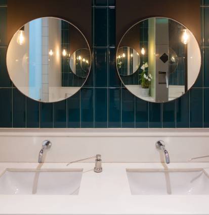 Row of modern marble ceramic wash basin in public toilet, restroom in restaurant or hotel or shopping mall, interior decoration design